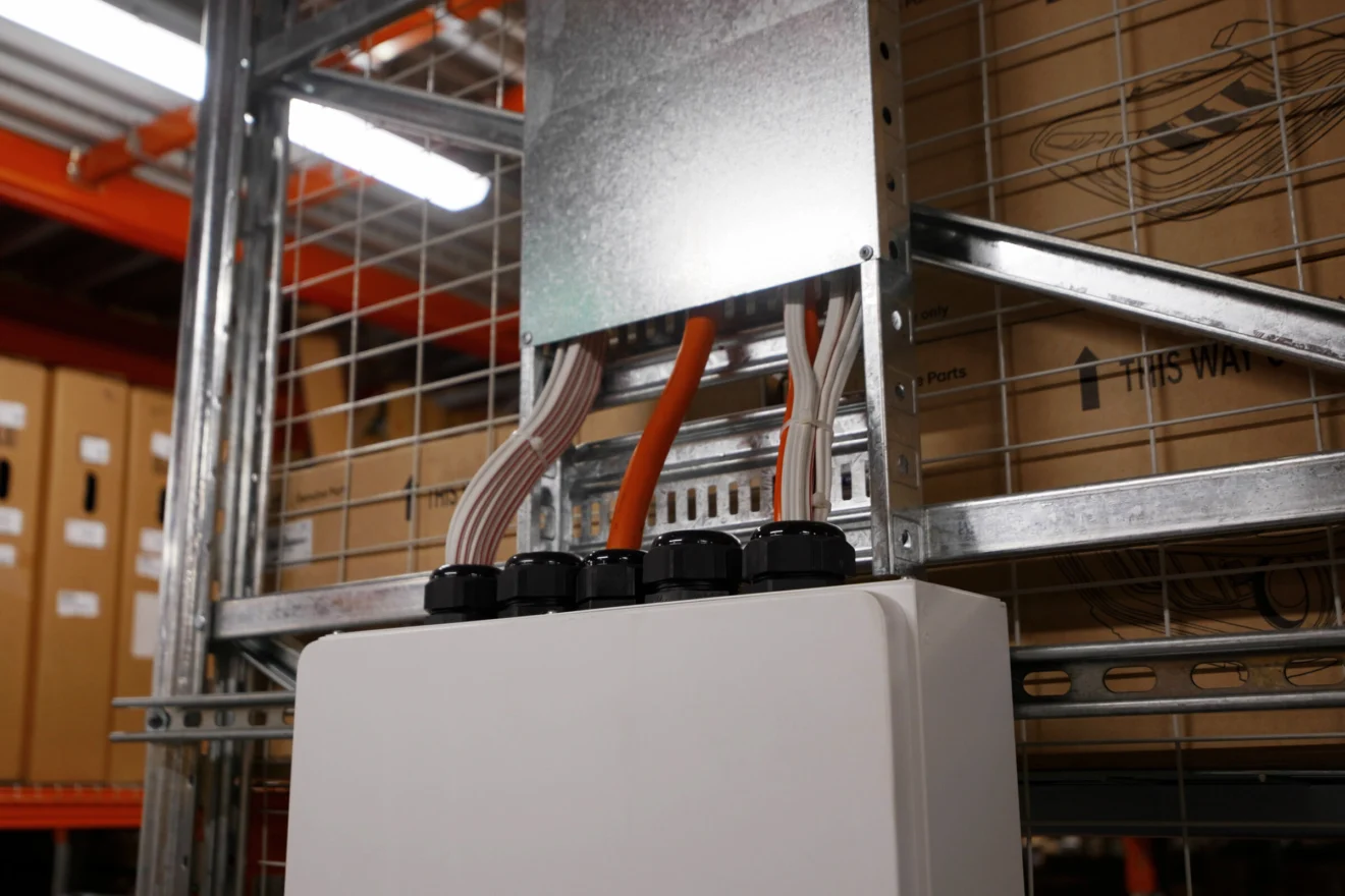 Power supply and conduit fitted to the racking at the Auto Parts Group warehouse by Marlec Electrical