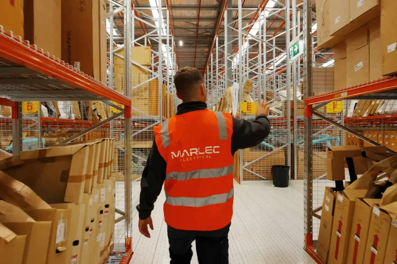 Marlec electrician checking the racking lights at the Auto Parts Group warehouse