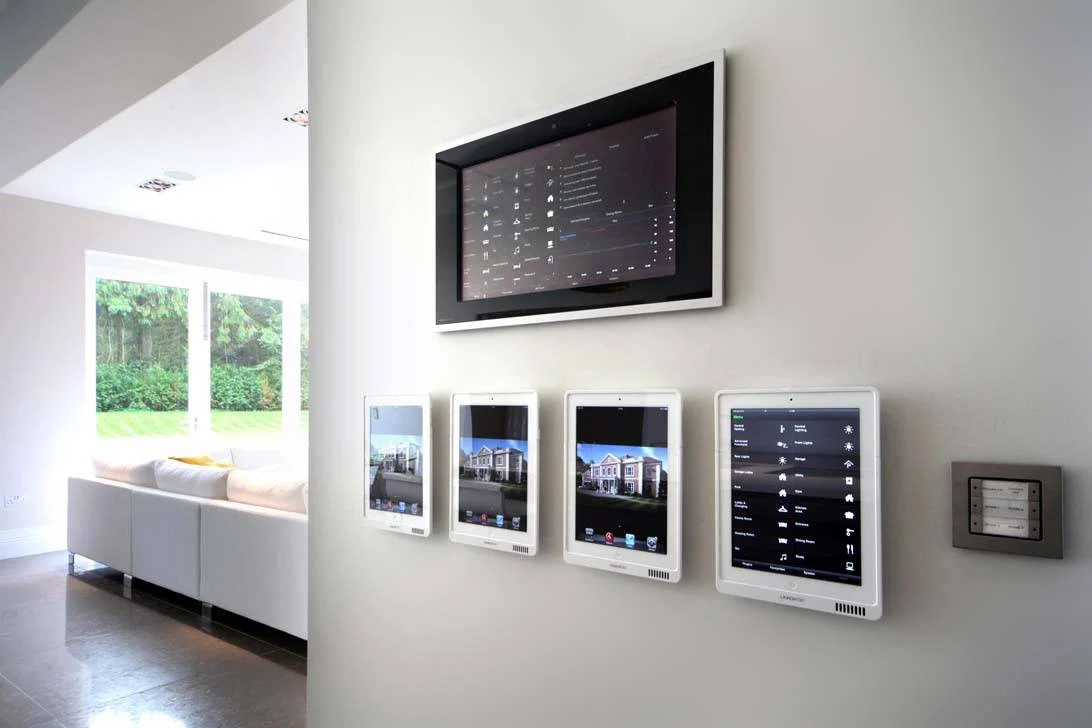 Smart home control panels on a living room wall