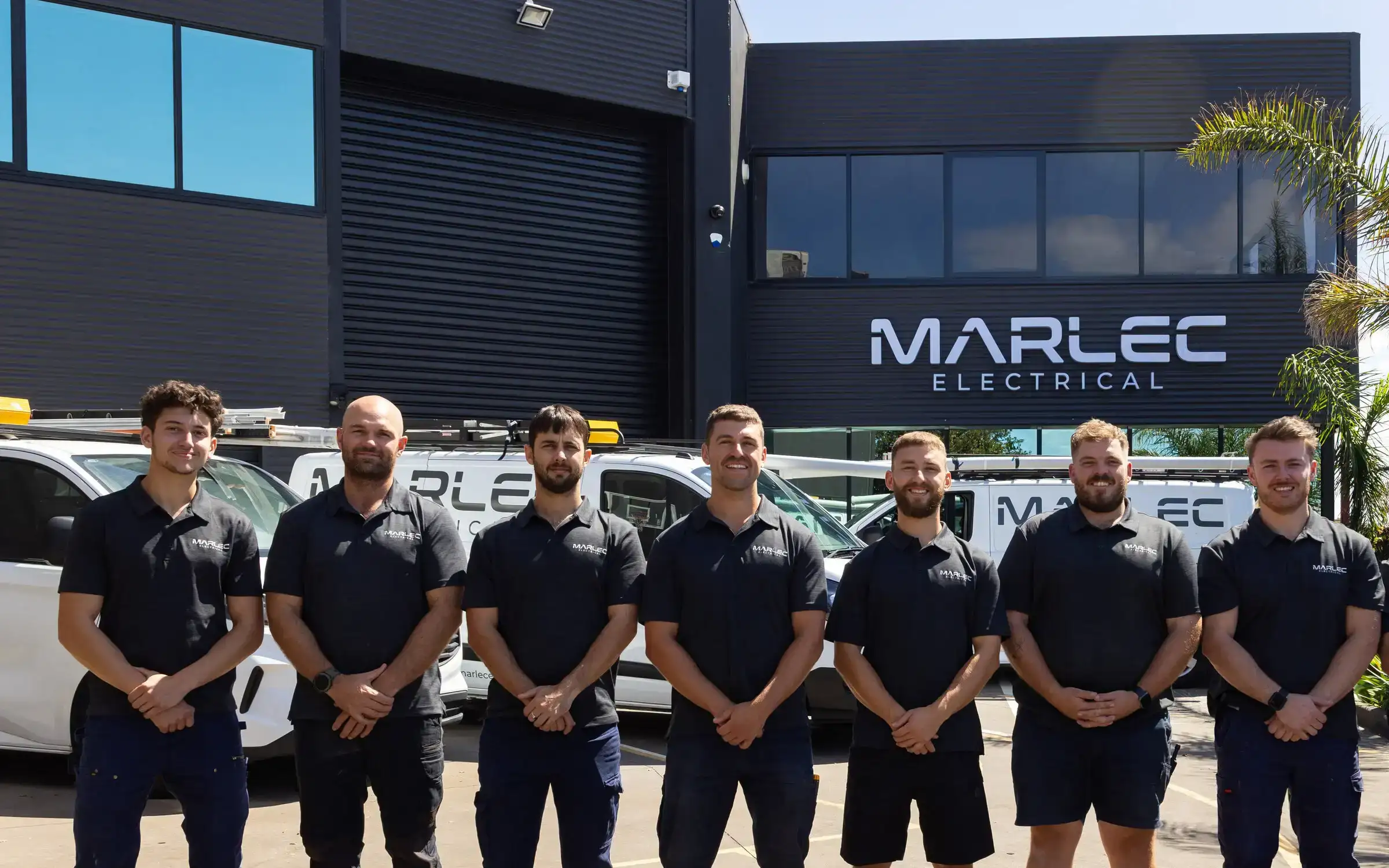The Marlec Electrical team standing together outside the Marlec workshop