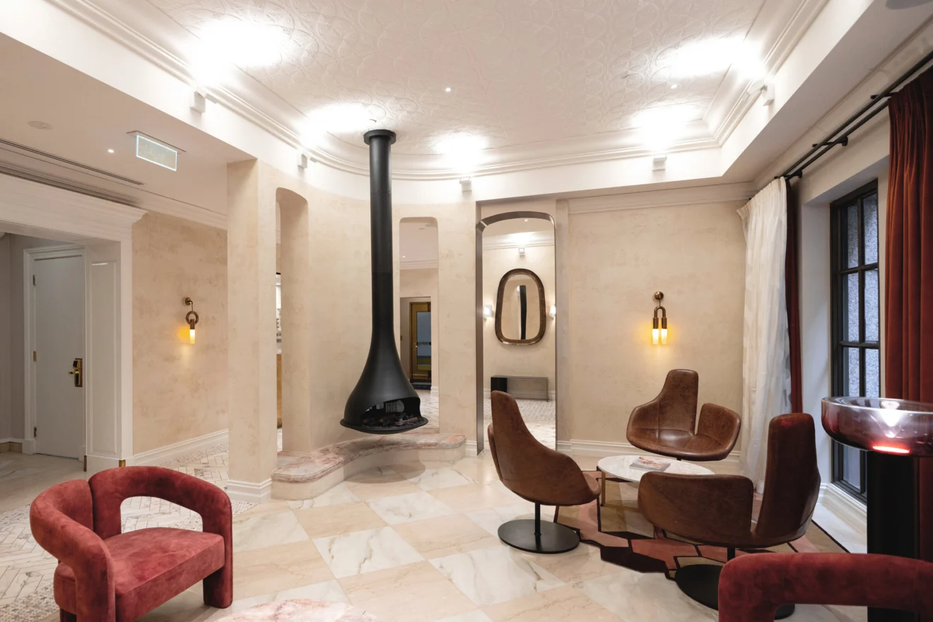 Hotel lounge with a suspended fireplace at The Sebel Melbourne, electrical refurbishment by Marlec Electrical